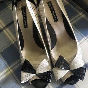 Used cream and white heels.